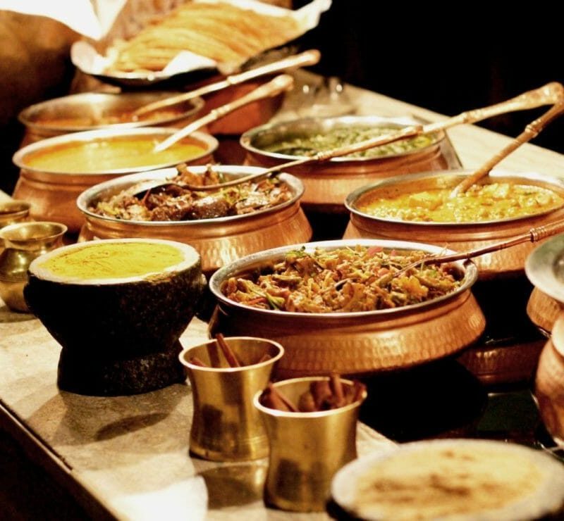 Colorful spread of Indian dishes at BarShala, top Indian dining spot in Hamilton