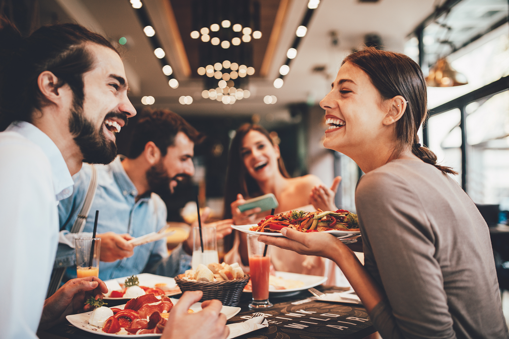 Smiling diners enjoying top-rated Indian food at BarShala in Hamilton