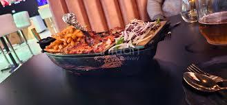 Tandoori chicken with tandoori roti in a plate showcasing that barshala also serves traditional indian meals in hamilton